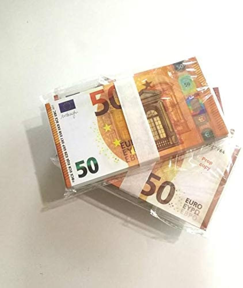 Bundles of 50‑euro banknotes wrapped in plastic and taped together on a white surface, viewed at an angle.
